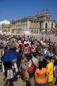 Tourists wait in a line at The Palace of Versailles at Versailles in the department of Yvelines, France.