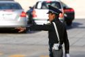 Female police officer directing traffic in Mexico City, Mexico.