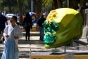 A large skull decorated with material is part of a public art display in celebration of the Day of the Dead in Mexico City, Mexico.