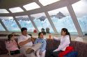 Family on a tour boat at the Perito Moreno Glacier located in the Los Glaciares National Park in the south west of Santa Cruz province, Patagonia, Argentina.
