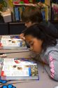 Fourth grade elementary students read textbooks in a classroom in Tampa, Florida.