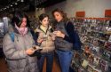 Teenage Italian girls shop for cds at a music store in Milano, Italy.