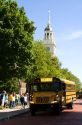 School bus parked in front of the Independence Hall replica at The Henry Ford Museum in Dearborn, Michigan.