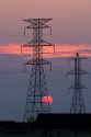High voltage electric transmission lines at sunset in Boise, Idaho.