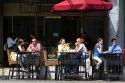 People dine at a sidewalk cafe in Vancouver, British Columbia, Canada.
