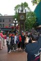 Asian tourists have their photo taken in front of the Gastown Steam Clock located in Vancouver, British Columbia, Canada.