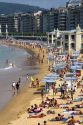 Beach scene at La Concha Bay in the city of Donostia-San Sebastian, Guipuzcoa, Basque Country, Northern Spain.