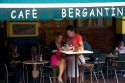 Customers paying their bill at the Cafe Bergantin in the town of Ribadesella, Asturias, northern Spain.