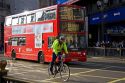 Double decker bus and bicyclist in London, England.