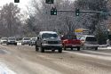 Automobiles driving in winter snow in Boise, Idaho, USA.
