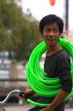 Vietnamese man with green tubing in Ho Chi Minh City, Vietnam.