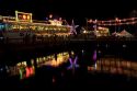 Floating restaurants on the Saigon River with lights at night in Ho Chi Minh City, Vietnam.