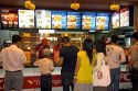 Vietnamese people eat at a Kentucky Fried Chicken restaurant inside the Diamond Plaza shopping center in downtown Ho Chi Minh City, Vietnam.