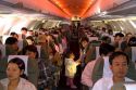 Passengers in their seats on an airliner in Vietnam.