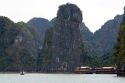 Scenic views of limestone isles and boats in Ha Long Bay, Vietnam.