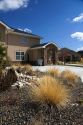 Xeriscaping using rock and native grass to conserve water at a residential home in Boise, Idaho, USA.