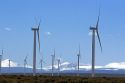 Wind generators amd Uinta Mountain Range along Interstate 80 east of Evanston, Wyoming, USA.