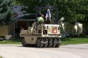 Rubber tire roller compacting chip seal pavement resurfacing treatment on a residential street in Boise, Idaho, USA.