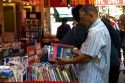 Customers shopping at a bookstore along Boulevard Saint-Michel in the Latin Quarter of Paris, France.