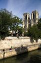 The western facade of the Notre Dame de Paris along the river Seine in Paris, France.
