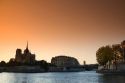 Nortre Dame cathedral and the River Seine at sunset in Paris, France.