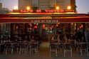 Cafe at dusk in the Latin Quarter of Paris, France.