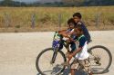 Costa Rican children ride a bicycle near the town of Nicoya, Costa Rica.