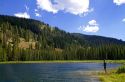 Fishing Bull Trout Lake located in the Boise National Forest near Lowman, Idaho, USA.