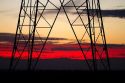 Electric transmission tower and sunset near Boise, Idaho, USA.