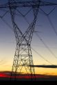 Electric transmission tower and sunset near Boise, Idaho, USA.