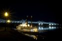 Steamboat docked at night near the Natchez-Vidalia Bridges spanning the Mississippi River between Vidalia, Louisiana and Natchez, Mississippi, USA.