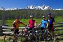 Touring bicyclists stop for a view of the Sawtooth Mountain Range near Stanley, Idaho, USA.