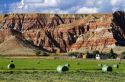 Red rock cliffs and newly harvested alfalfa hay near Dubois, Wyoming, USA.
