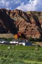 Red rock cliffs and newly harvested alfalfa hay near Dubois, Wyoming, USA.