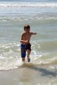 Seven year old boy playing at Madeira Beach in Pinellas County, Florida, USA.