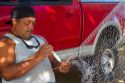 Native hawaiian fisherman mending a net on the island of Kauai, Hawaii, USA. MR