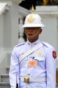 Guard wearing a white uniform at The Grand Palace in Bangkok, Thailand.