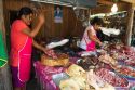 Women chopping and selling meat at an open air market on the island of Ko Samui, Thailand.
