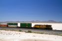 Union Pacific Railroad locomotive traveling along Interstate 10 through southwest New Mexico, USA.