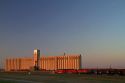 BNSF Railway train in front of the Agri Producers Grain Corp grain elevators at Plainview, Texas, USA.