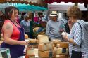 American tourist purchasing cheese at a Basque market at Saint-Jean-de-Luz in the Basque province of Labourd, southwestern France.