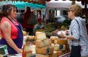 American tourist purchasing cheese at a Basque market at Saint-Jean-de-Luz in the Basque province of Labourd, southwestern France.