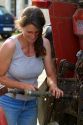 French woman working on farm equipment near Angouleme in southwestern France. MR