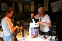 French woman purchasing wine at a winery in rural Angouleme in southwestern France.