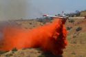 Single engine air tanker (SEAT) dropping fire retardant on a wildfire in Idaho, USA.