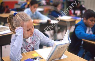Children reading in an Elementary school classroom in Brandon, Florida. MR