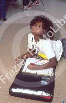 Female African American student studying in an elementary school classroom in Florida.