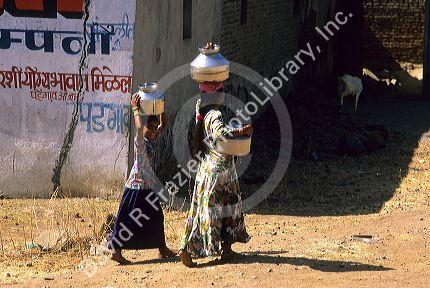 Women carrying water in India.