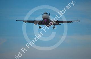 Airbus 320 landing at dusk.