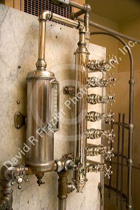 Fordyce historic bath house interior showing water valves in Hot Springs, Arkansas.historic, historic buildings, historic town, bath house, bathhouse, hot springs, arkansas, hot springs national park, fordyce, headquarters, valves, water valves, plumbing